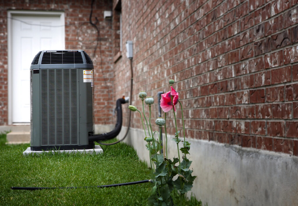 High efficiency modern HVAC unit in backyard